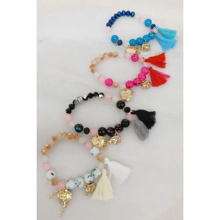 Bracelet à pompon avec breloque éléphant et cœur